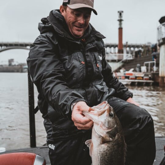 Scott Canterbury holding up a largemouth bass he caught